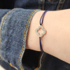 Bracelet religieux cordon croix lobée rosace et zircons lumière