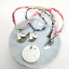 Collier Esprit Saint colombe blanche sur nacre fumée pour jeune fille