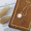 Collier religieux avec la croix de saint Benoit en nacre sur chaine